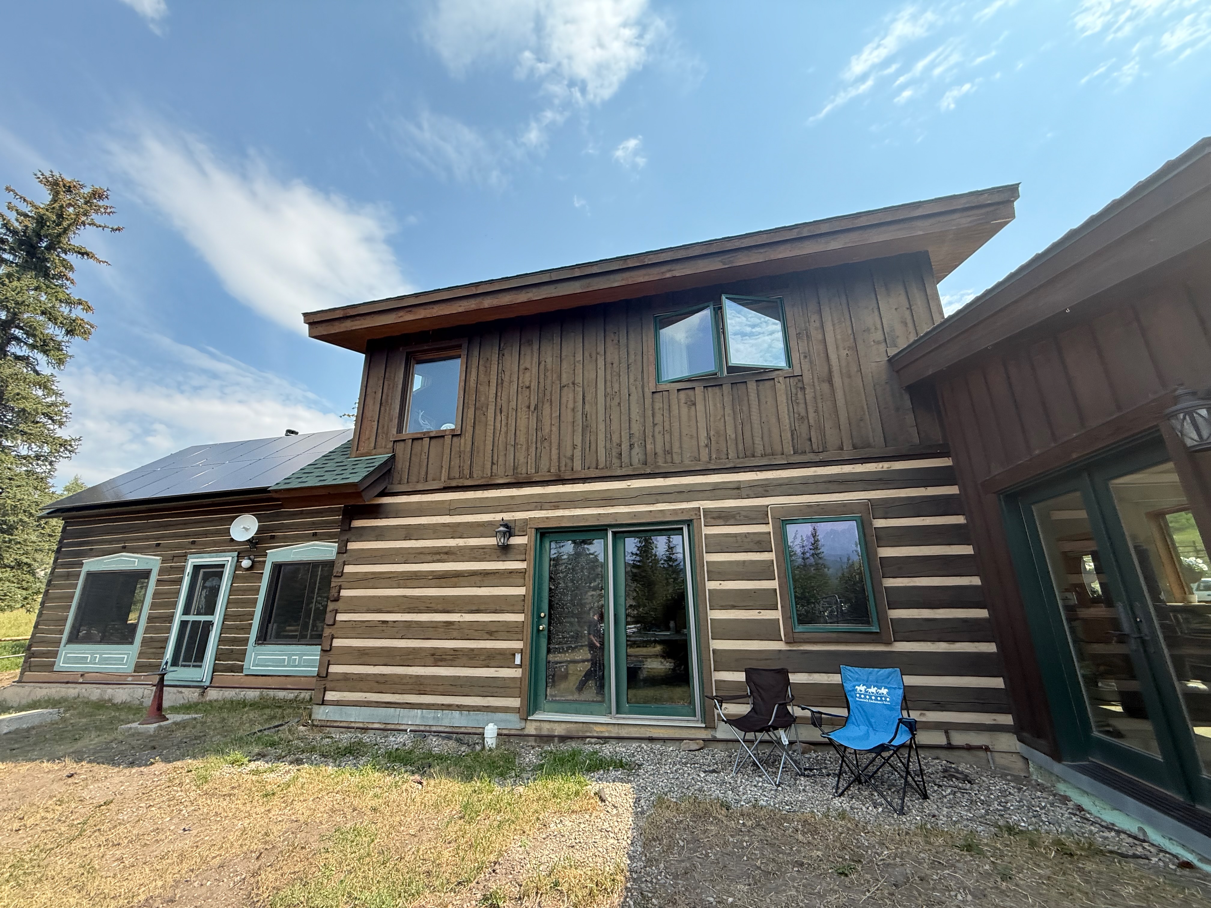 Detailed exterior view of restored log home wall